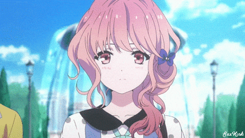 a girl with pink hair and a blue flower in her hair is looking at the camera