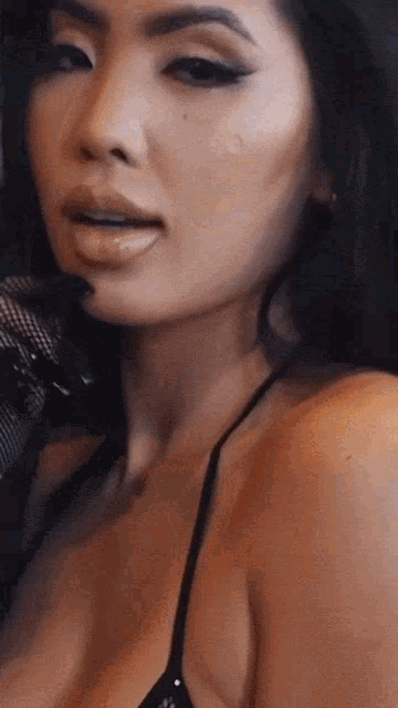 a close up of a woman with her tongue out