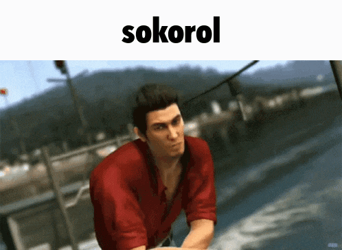 a man in a red shirt is standing in front of a sign that says sokrol