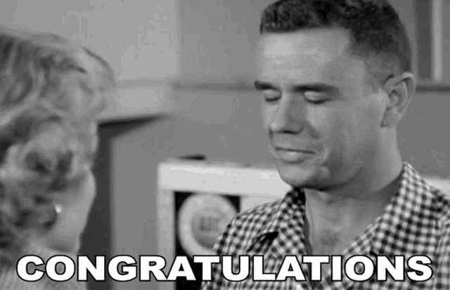 a black and white photo of a man and a woman with the words congratulations below him