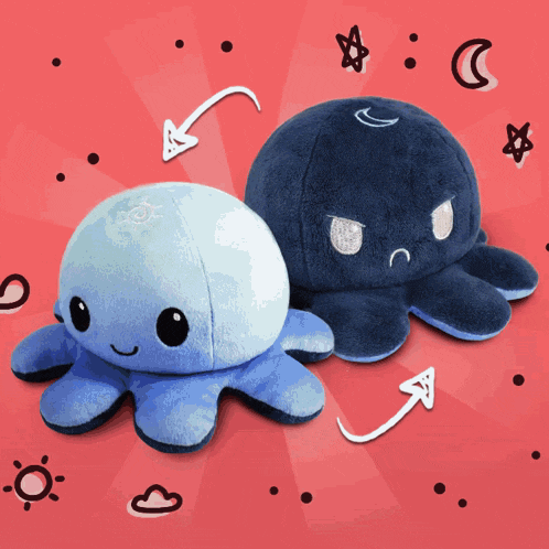 a blue and black stuffed octopus with a white arrow pointing to it