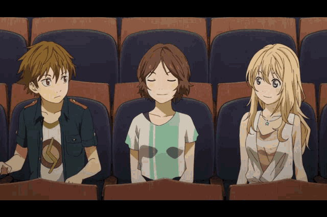 three anime characters are sitting in a theater watching a movie