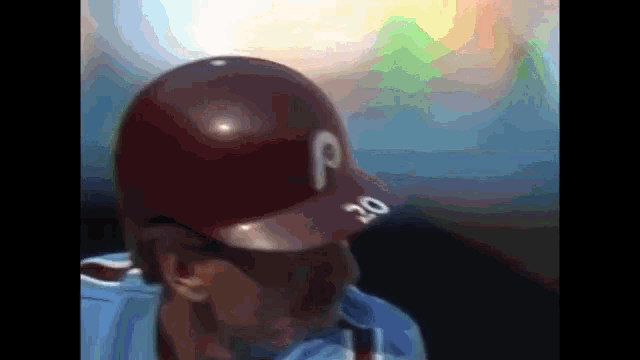a baseball player with the number 20 on his cap