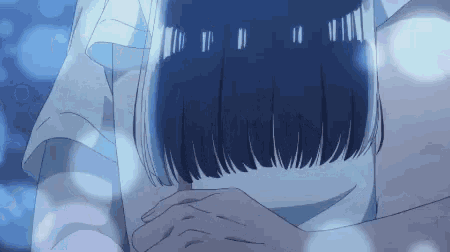 a close up of a person 's shoulder with a blue background .