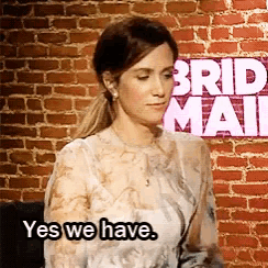 a woman says yes we have in front of a sign that says bride mail