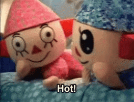 two stuffed animals are laying next to each other and one of them says hot