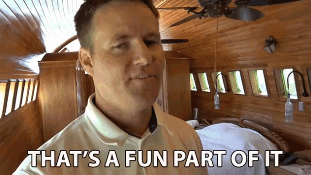 a man says that 's a fun part of it in front of a wooden wall