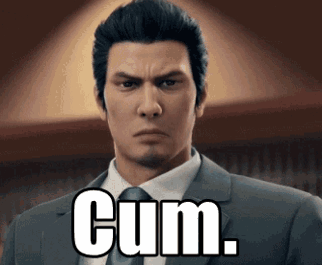 a man in a suit and tie is making a funny face and says cum .