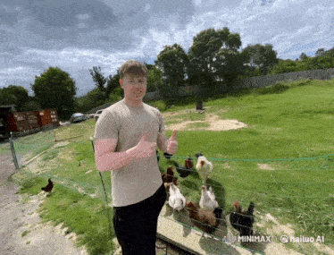 a man giving a thumbs up in front of a fence with chickens