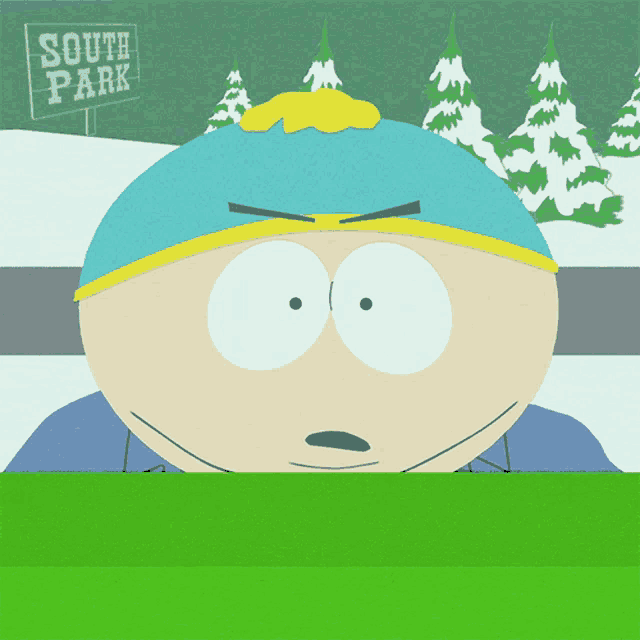 a cartoon character from south park is sitting in front of a sign that says south park