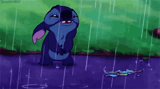 stitch from disney 's lilo and stitch standing in the rain .