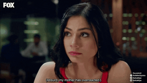 a woman in a red dress is talking about her mother