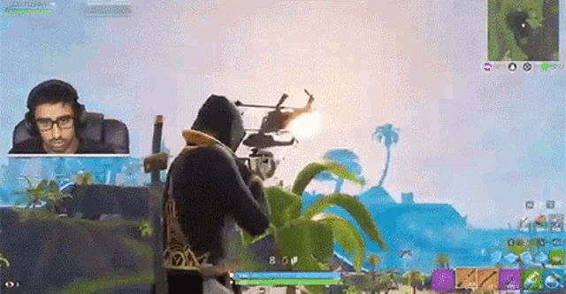 a man is playing a video game with a helicopter flying overhead .