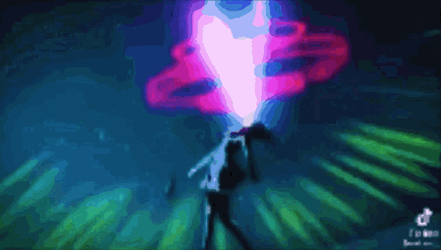 a blurry picture of a person with a heart coming out of their chest