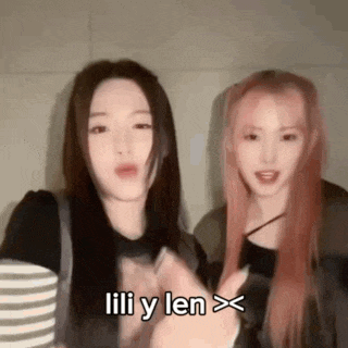 a couple of women standing next to each other with the words lili y len written on the bottom .