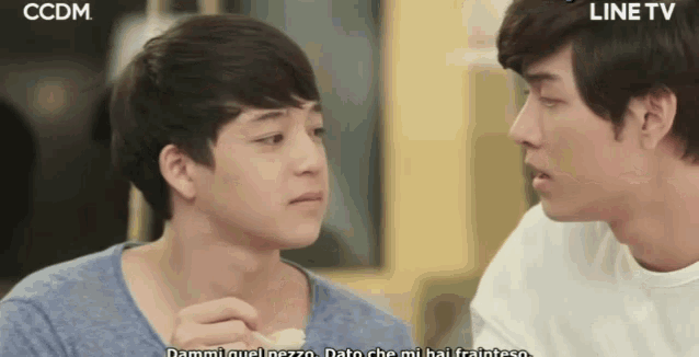 two young men looking at each other with ccdm on the bottom right