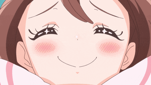 a close up of a woman 's face with a smile on her face
