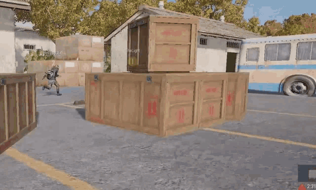 a person is standing behind a wooden box in a video game with boxes in the background .