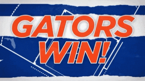 a sign that says gators win on a blue and white striped background