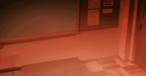a statue of liberty in a dark room with a red background