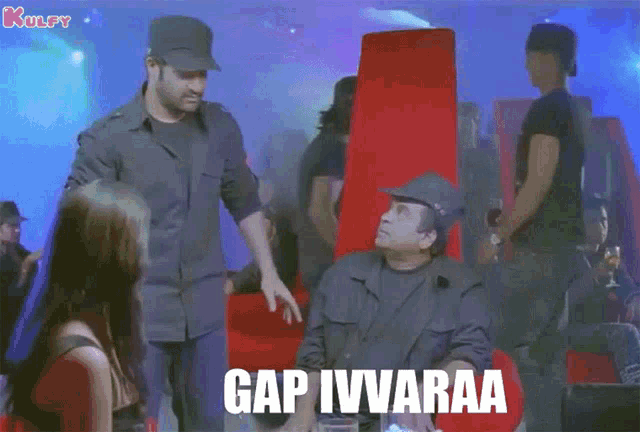 a man sitting in a chair talking to another man with the caption gap ivvaraa on the screen