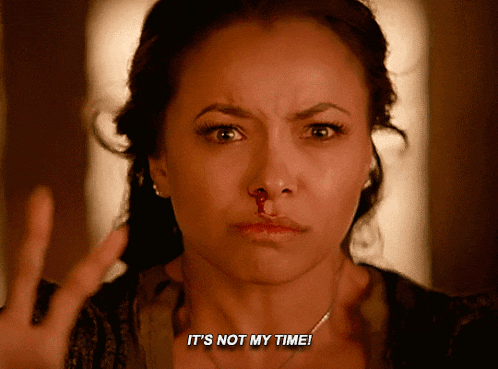 a woman with a bloody nose has the words it 's not my time written on her face