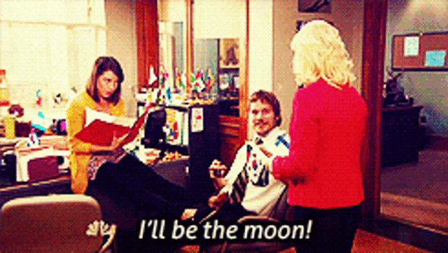 a woman in a red sweater says i 'll be the moon in front of a group of people