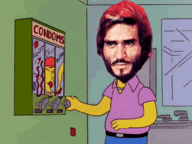 a man in a pink shirt is using a condom machine