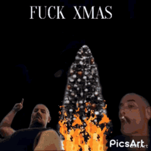 a man smoking a cigarette in front of a christmas tree with the words fuck xmas