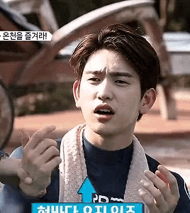 a young man is making a funny face with an arrow pointing to the right