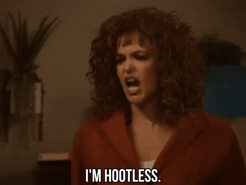 a woman with curly hair is saying i 'm hootless