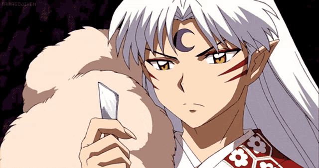 a cartoon character with white hair and a crescent moon on his head