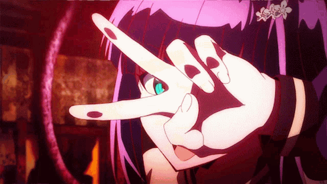 a girl with purple hair making a peace sign with her hands