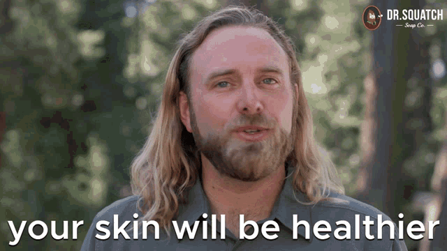 a man with long hair and a beard is talking about his skin being healthier