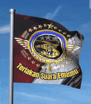 a flag that says " teriak suara emasmu " is flying in the wind