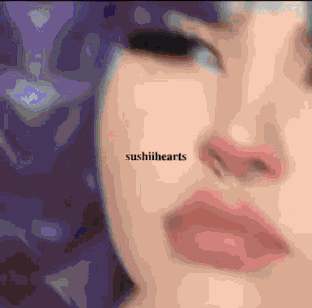 a close up of a woman 's face with the words sushihearts visible