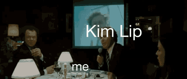 a blurred image with the words kim lip me written on it