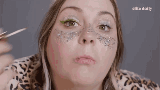 a close up of a woman 's face with elite daily written on the bottom right