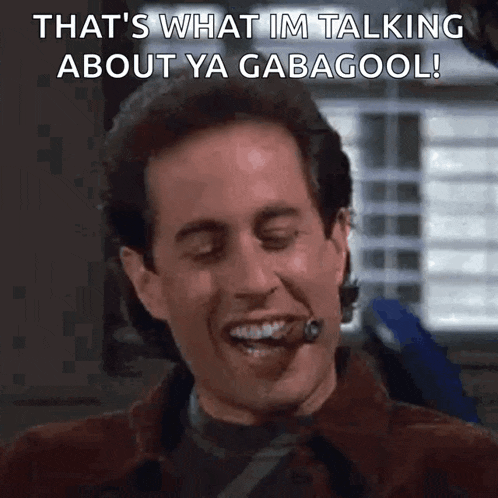 a man with a cigar in his mouth is smiling and saying that 's what im talking about ya gabagool