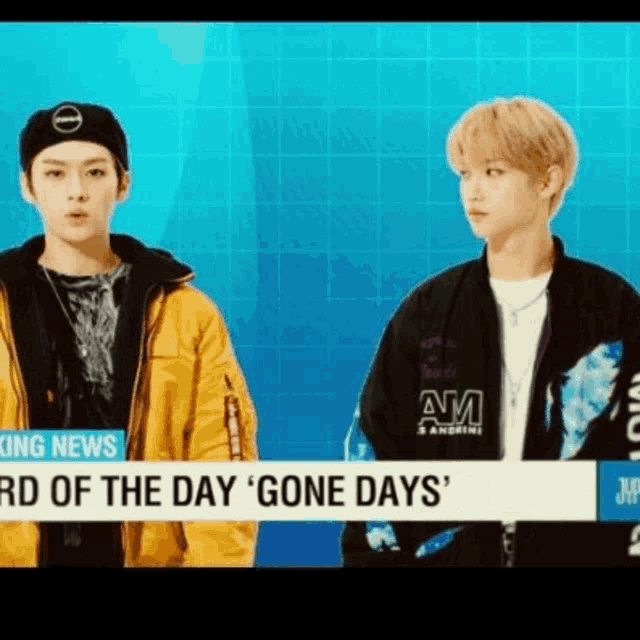 two young men are standing next to each other in front of a sign that says ' gone days ' on it .