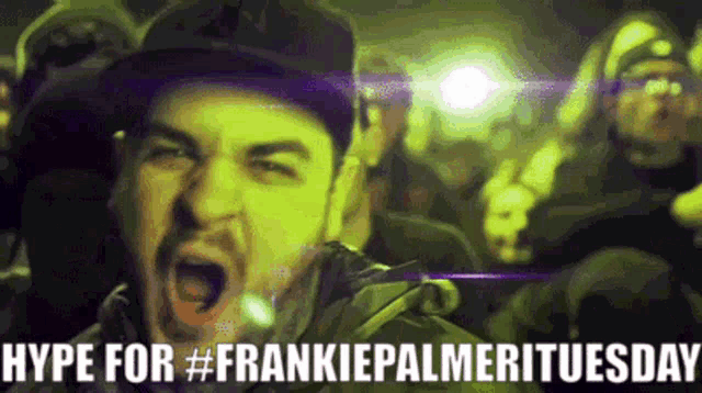 a man is screaming in front of a crowd with the words hype for #frankiepalmerituesday