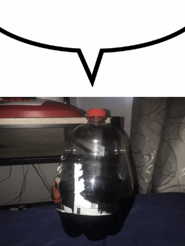 a bottle of soda sits on a table next to a speech bubble with the letter v on it
