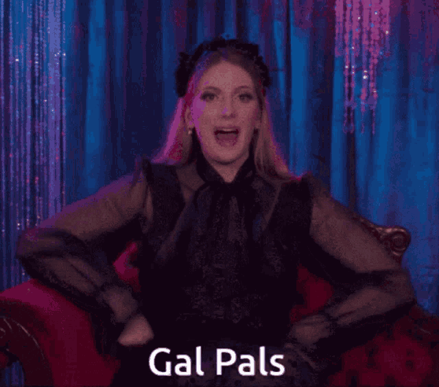 a woman in a black dress is sitting in a red chair with the words gal pals written on the bottom