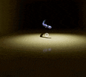a shadow of a person is cast on a surface