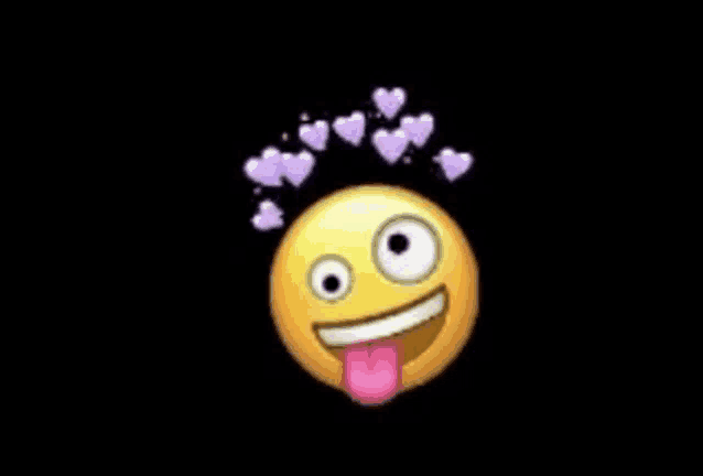 a yellow smiley face with its tongue out and hearts coming out of it .