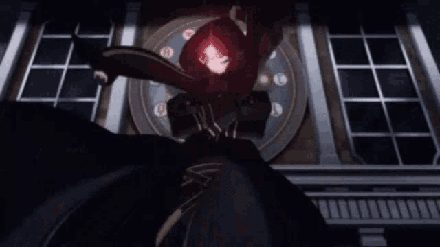 a person in a dark room with a red light coming out of their hood