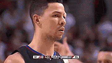 a basketball player is looking at the scoreboard during a game between lac and portland