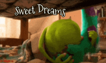 mike wazowski from monsters inc is sleeping in a bed with the words sweet dreams above him