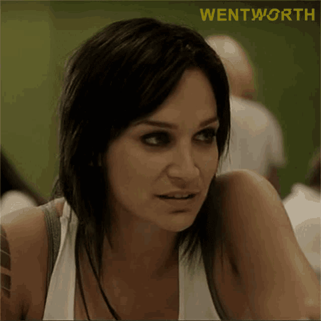 a close up of a woman 's face with the word wentworth on the bottom right
