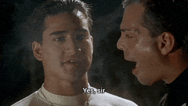 two men are talking to each other and one of them is saying yes sir